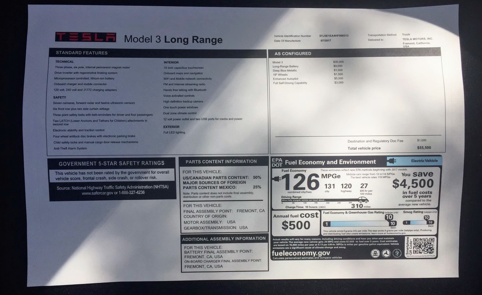20170922114511tesla-model-3-long-range-window-sticker (1)
